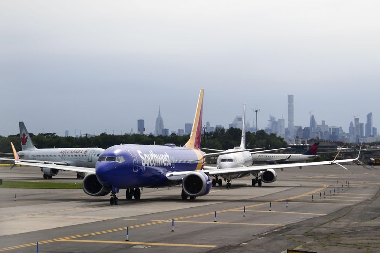 A Southwest Airlines plane lines up with other aircraft on the tarmac